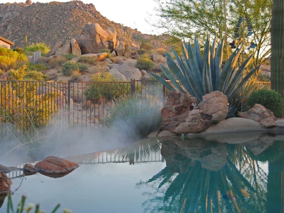 Patio misting system cooling an outdoor space in Mesa