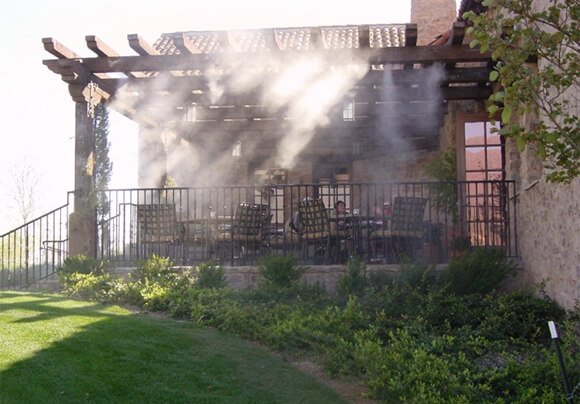 Outdoor misting system cooling a commercial patio space in Mesa