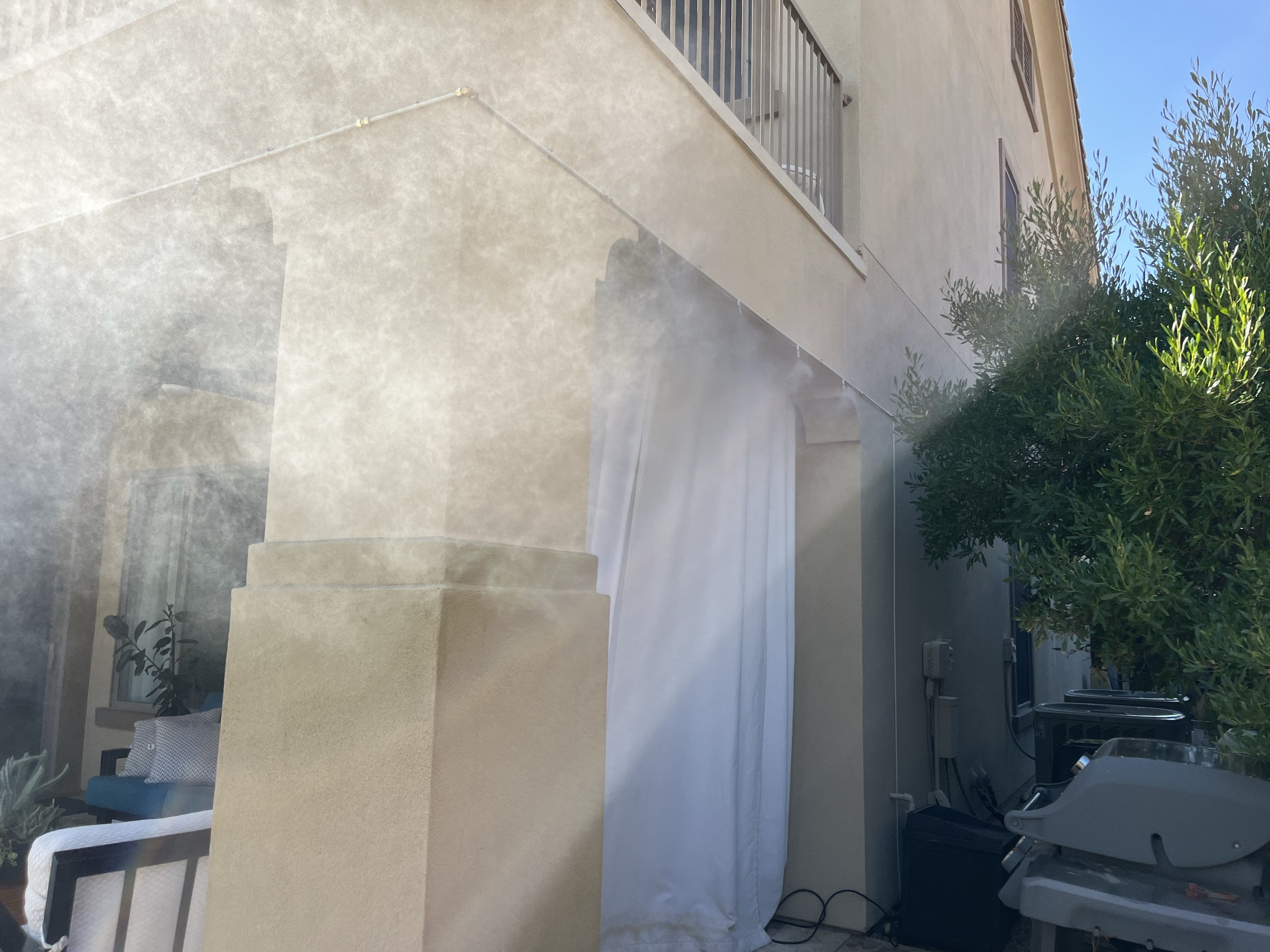 Patio misting system cooling an outdoor space in Surprise