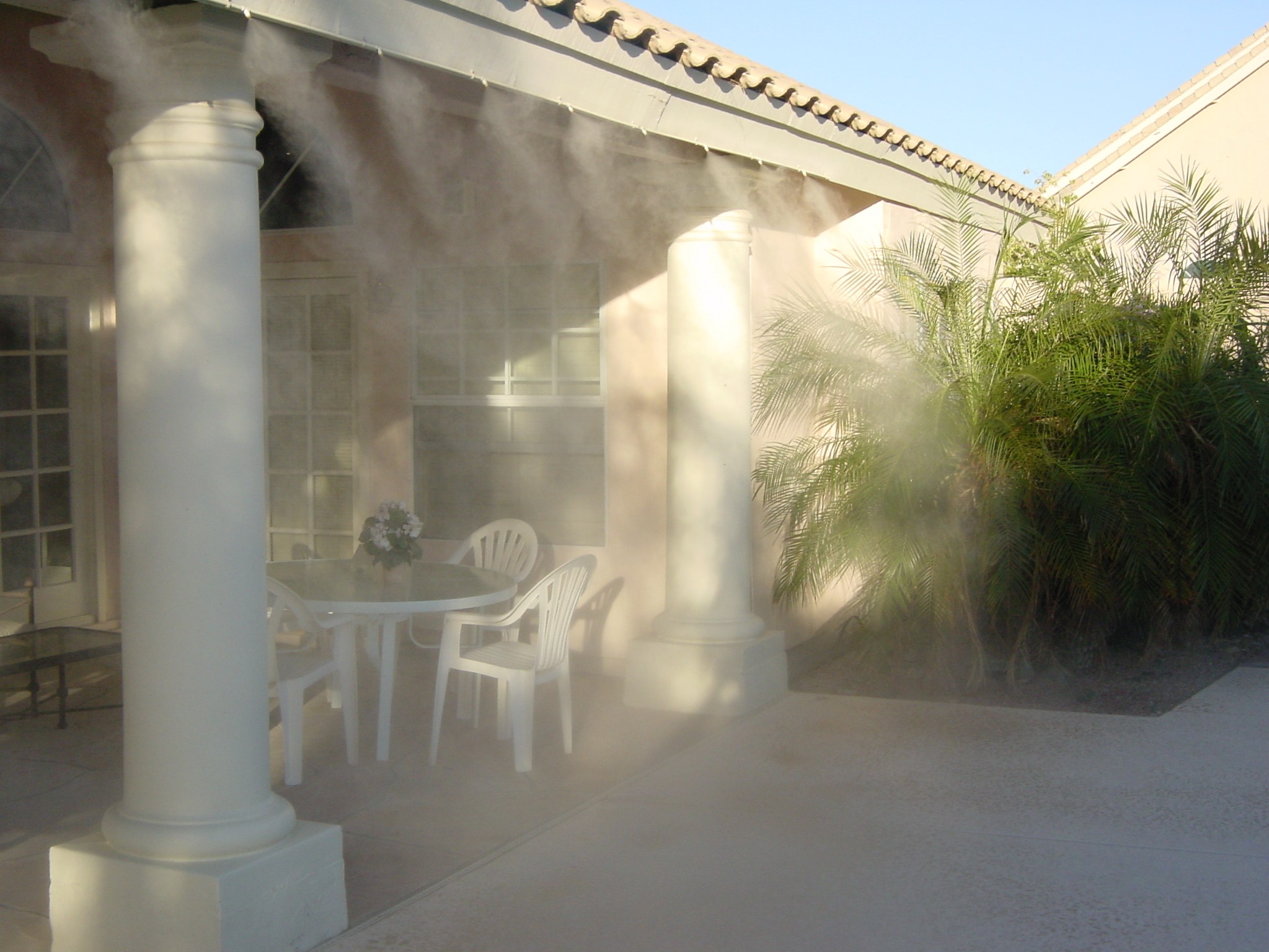 Patio misting system cooling an outdoor space in Tempe