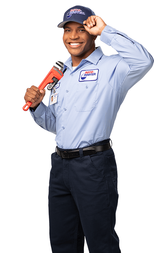 Roto-Rooter technician tipping hat holding wrench