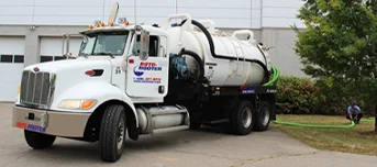 Roto-Rooter Plumbing Truck harboring drainage input from technician